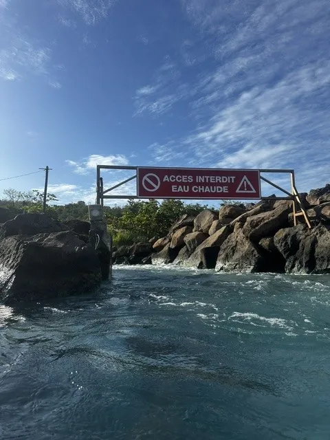 Volcanic hot-water pool on the rocky shore