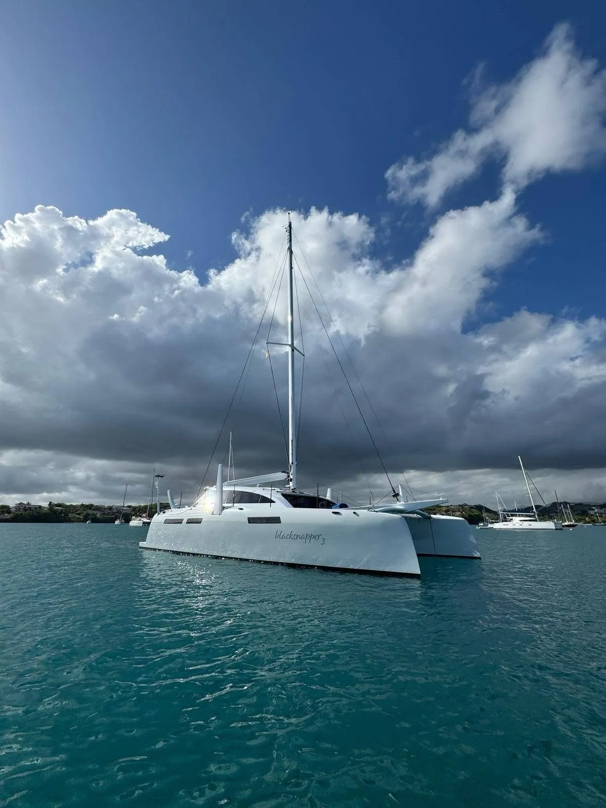 Catamaran at anchor under a big Caribbean sky